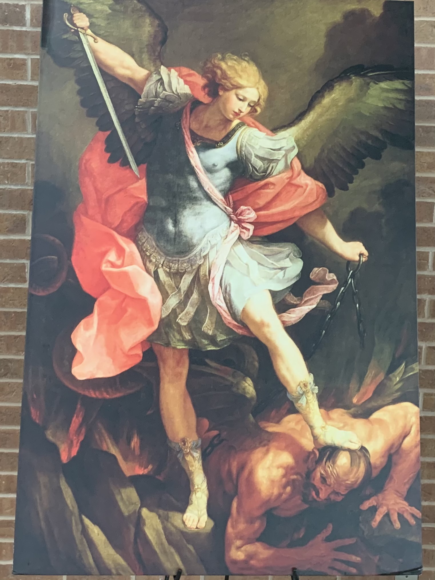 A picture of St. Michael the Archangel battling the devil